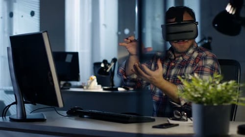 Man Uses Virtual Reality Headset in Office