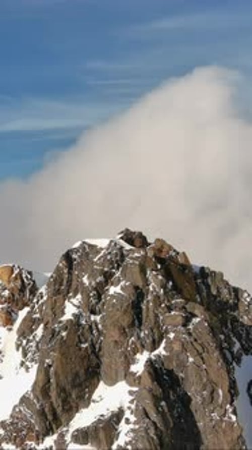 Snowy Mountain Peaks Under Blue Skies. British Columbia, Canada.