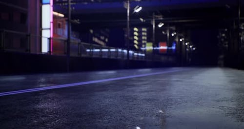 Nighttime City Street Reflecting Neon Lights After Rain