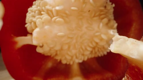 Red Bell Pepper being Cut in Half