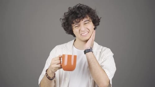 Young man with tooth sensitivity.