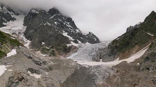 Aerial View of Svaneti Mountains Chalaadi Glacier in Georgia Snowcovered Peaks Rocky Slopes Icy