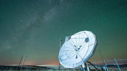Satellite Dish under Starry Night Sky with Milky Way