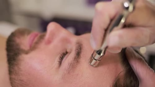 Man Receiving Facial Treatment Close Up