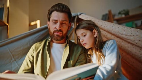 Closeup Parent Child Reading Book Blanket Fort Smiling Father Sharing Story