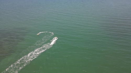 4K Two jet ski over green water sea water sports aerial