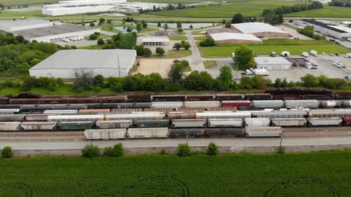 Aerial View of Train Cars and Rural Landscape