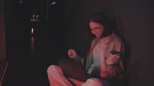 Woman Shopping Online at Night with Laptop