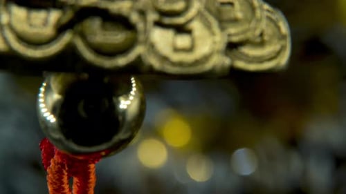 Chinese New Year traditional golden chicken zodiac statue, hanging shiny gold rooster sitting on mon