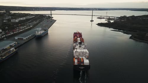 Aerial View a Container Ship with Colorful Containers Cruising in Halifax Harbor