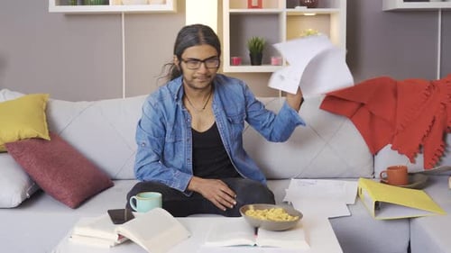 Stressed adult working from home on couch