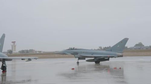 Military Jet on Wet Runway