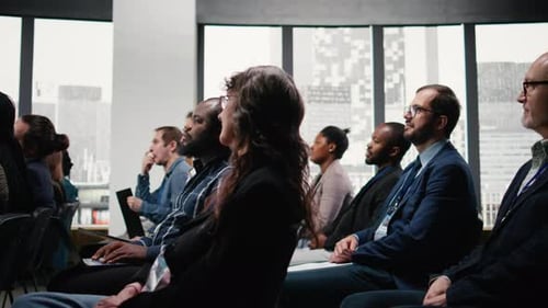Diverse Adults Attending Corporate Conference in Modern Office