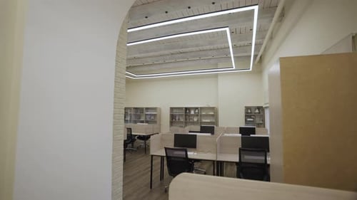 Lecture Hall Features Enclosed Desks Equipped with Computers