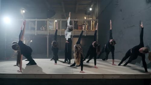 Dance Students Exercising in Side Plank Position