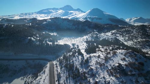 Snow Covered Mountain Range Aerial View