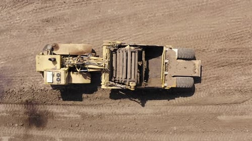 Large Elevating Scraper working at an Urban development site