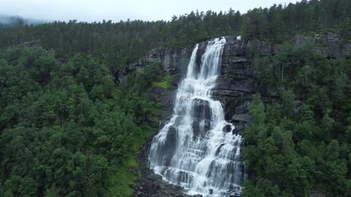 Waterfall in mountains. Outdoor nature in Norway