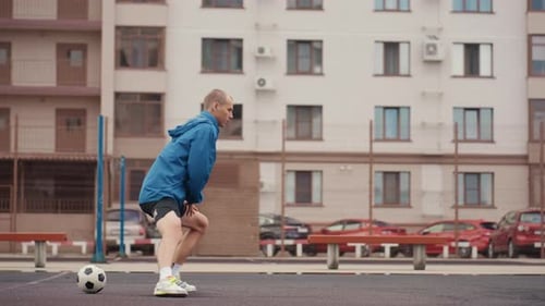 Urban Game with Quick Footwork Street Soccer Session with Focused Athlete in Motion Solo Practice of