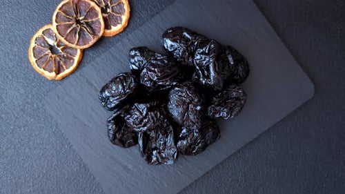 Delicious Dried Prunes and Dried Oranges Still Life