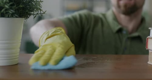 Adult Cleaning Wooden Table with Cloth and Spray
