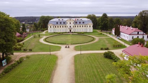 Majestic manor of Kraslava with green grass and circle road, aerial view
