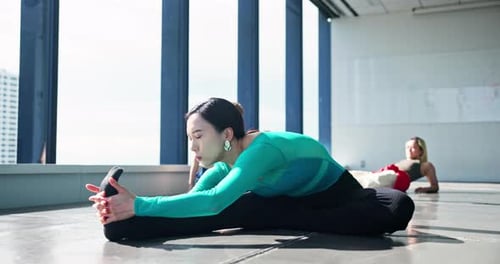 Fitness, dancer and girl stretching legs on floor in studio for health, body wellness