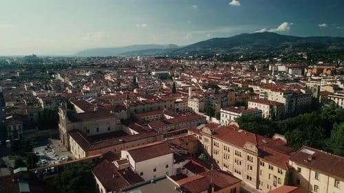 Drone Shot of Florence Italy Showing Historic Rooftops and City Streets in Warm Morning Light