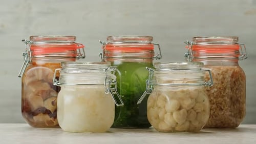 Fermented Champignons Jar with Marinated Mushrooms on Wooden Table Traditional Salted Marinated