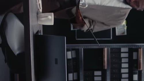 Vertical Video Young Policeman Examining Forensic Evidence in Office