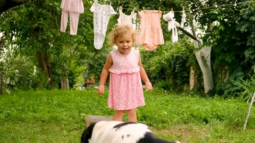 The Child is Washing Clothes in the Garden Selective Focus