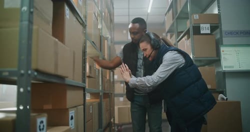 Multiethnic Warehouse Associates Working in Sorting Center of Delivery Service