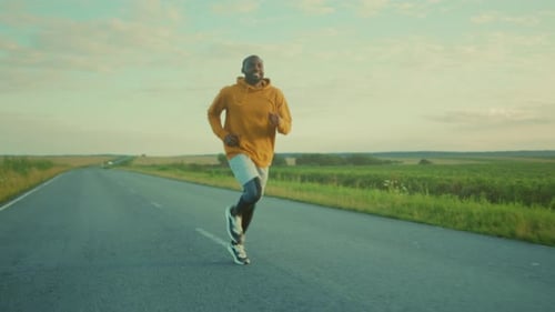 Man Running on Country Road for Exercise