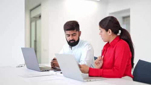 Professional Indian Colleagues Collaborating in Office