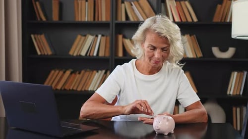 Saving Money Investment for Future Senior Adult Mature Woman Putting Money Coin in Piggy Bank Old
