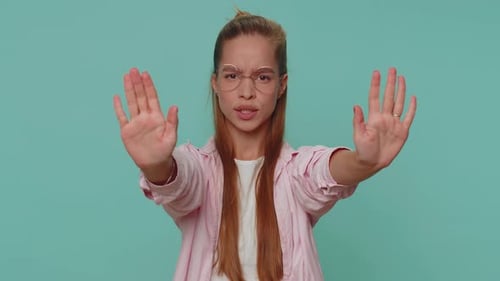 Girl Kid Say No Hold Palm Folded Crossed Hands in Stop Gesture Warning of Finish Prohibited Access