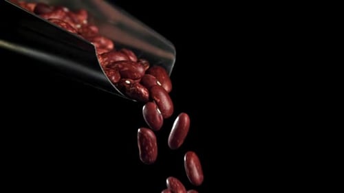 Kidney Beans Poured from Scoop Close Up