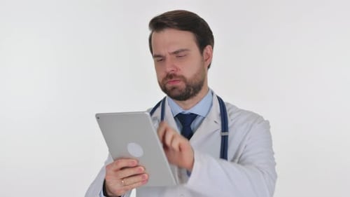 Male Doctor Uses Tablet in Clinical Setting