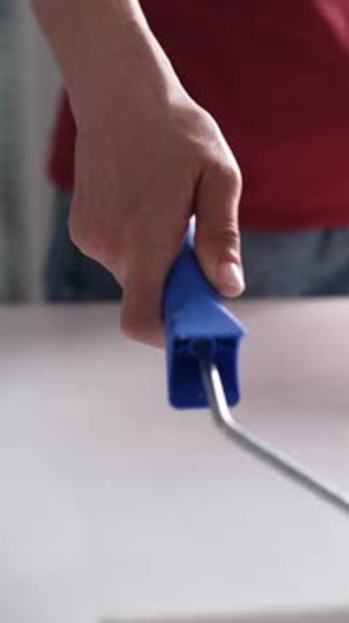 Hand Painting with Paint Roller Close Up