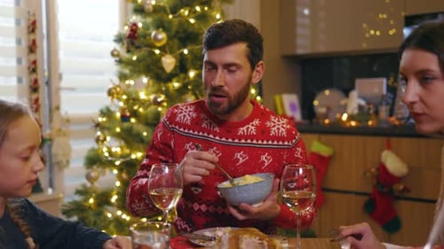 Family eating Christmas dinner together at home