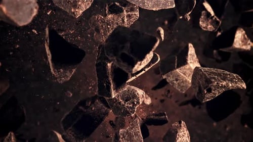 Pieces of Chocolate Rotate in Flight