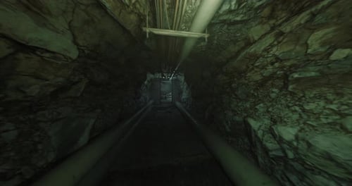 Narrow Vertical Shaft Featuring Corroded Fittings and Safety Remnants