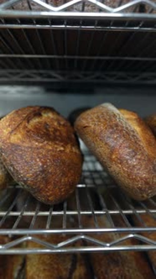 The Bakery's Shelves are Stocked with a Selection of Freshly Baked Craft Bread