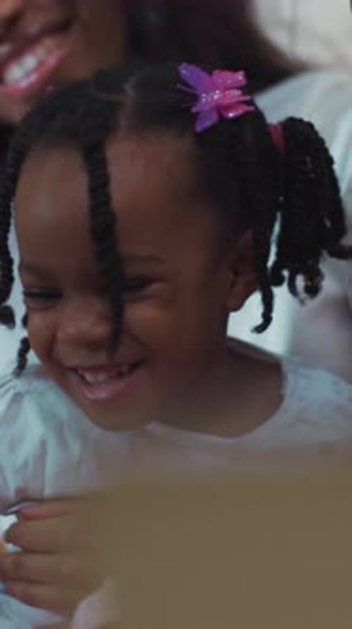 Smiling Family Sharing Affection Indoors