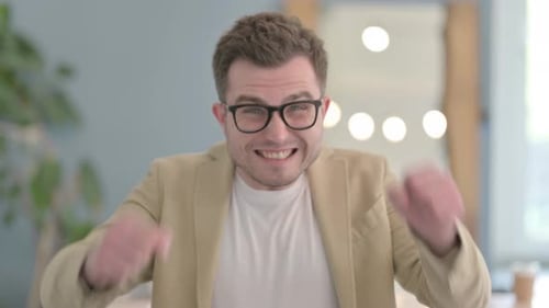 Excited Man Reacts Positively to Good News