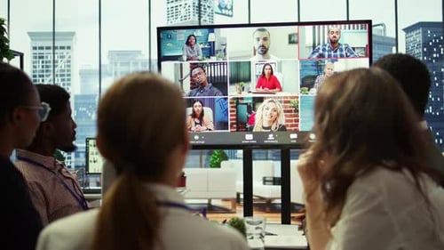 Company Employees Attending a Meeting Via Videocall with Investors