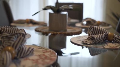 Modern Table Setting with Striped Napkins and Decor