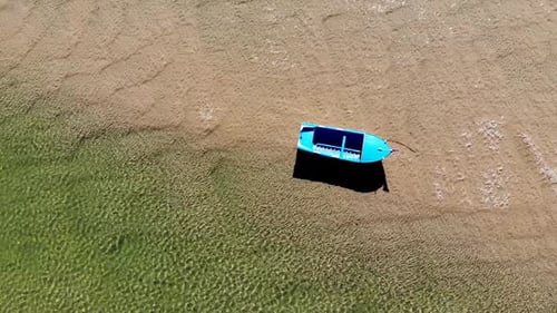 Closing in on a Boat on the Shore