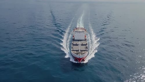An Aerial View of a Beautiful Ship Sailing Gracefully Across the Calm Ocean Waters