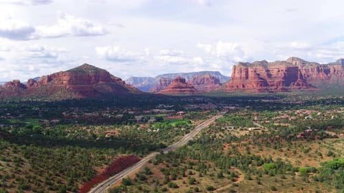Highway leads to majestic red rock formations of sedona Arizona by drone